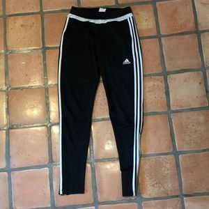 Black adidas joggers with white stripes
